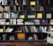 A decorative faux book box used as a shelf riser