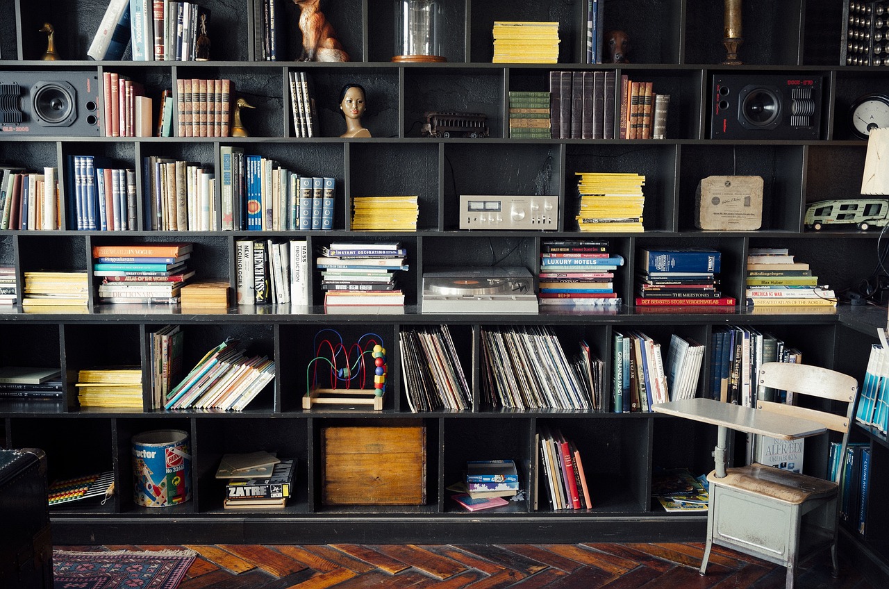 A decorative faux book box used as a shelf riser